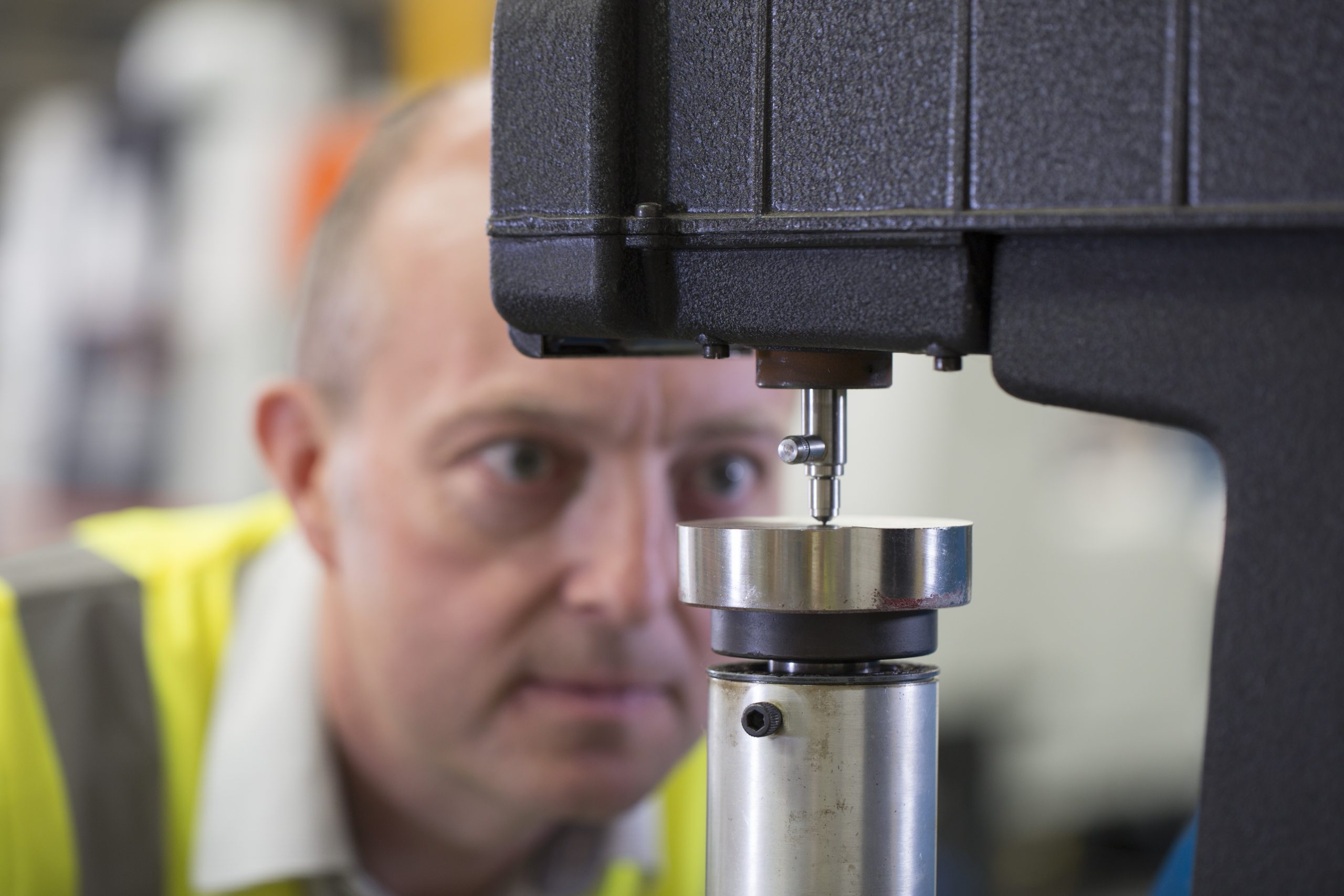 Man Performing Hardness Testing