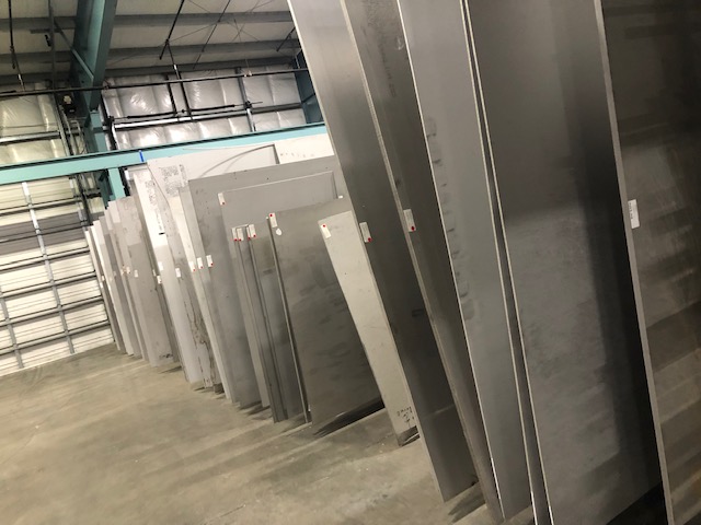 Metal Plates Lined Up Next to Each Other